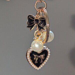 Bag charm/Key chain, feminine, pearls, heart, bow. Black and white.